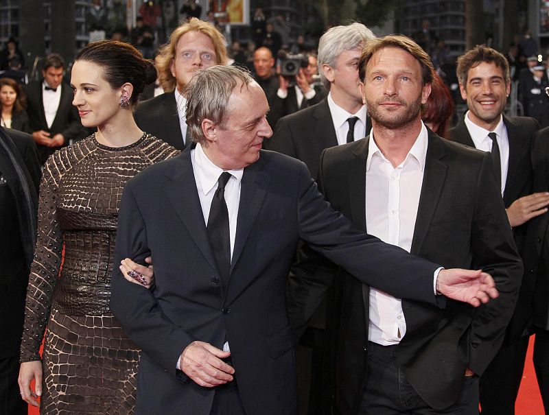 Director Argento and his daughter Asia pose with cast member Kretschmann on the red carpet for the screening of the film Dario Argento Dracula at the 65th Cannes Film Festival