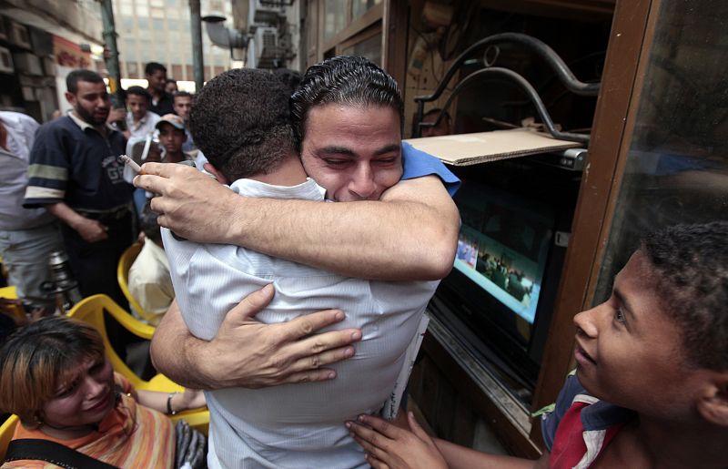 An Egyptian celebrates after a court sentenced deposed Egyptian president Hosni Mubarak to life in prison at Tahrir Square in Cairo