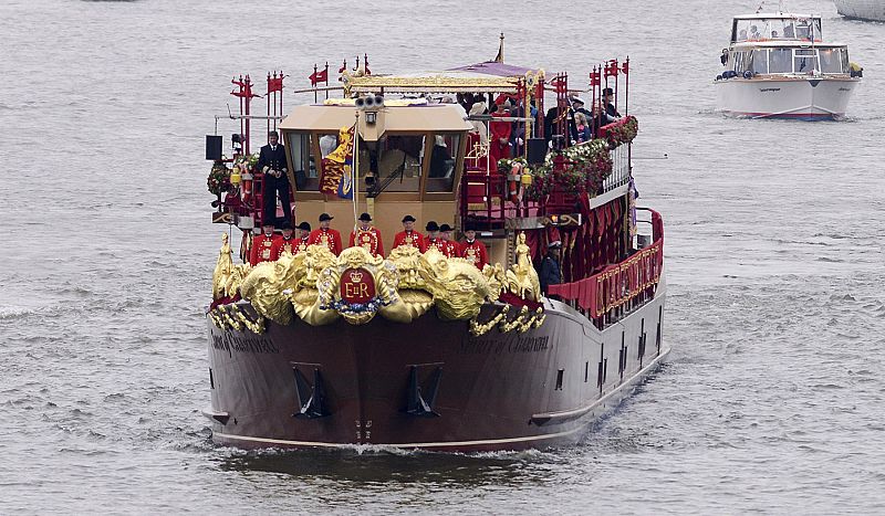 The Spirit of Chartwell, carrying members of Britain's royal family, approaches Chelsea Bridge during the Queens Diamond Jubilee Pageant on the River Thames in London