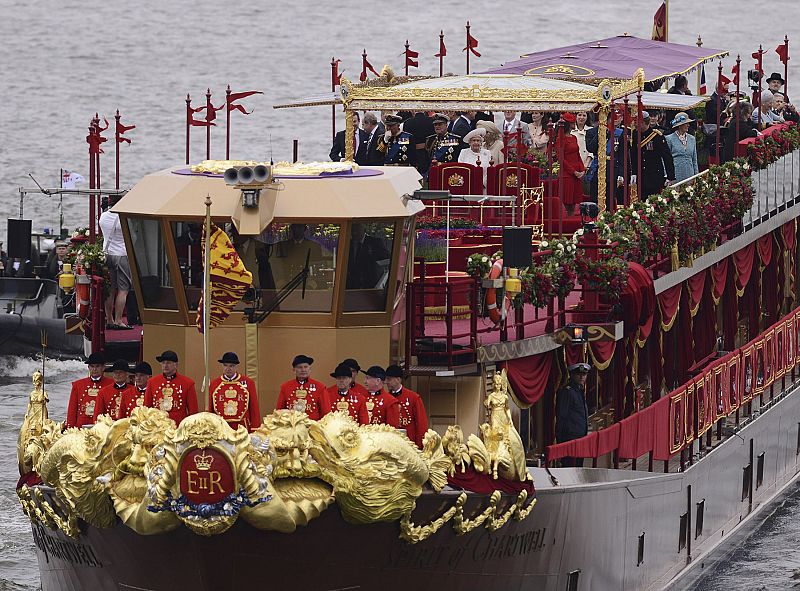 The Spirit of Chartwell, carrying members of Britain's royal family, approaches Chelsea Bridge during the Queens Diamond Jubilee Pageant on the River Thames in London