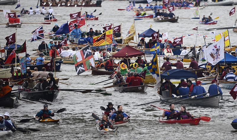 Boats take part in a pageant in celebration of the Queen's Diamond Jubilee, along the River Thames in London