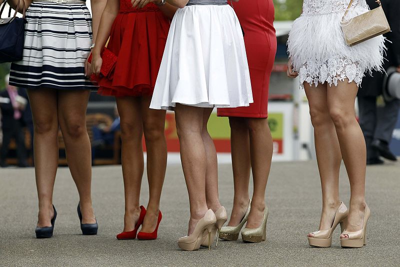 Race goers attend the second day of racing at the Royal Ascot, southwest of London