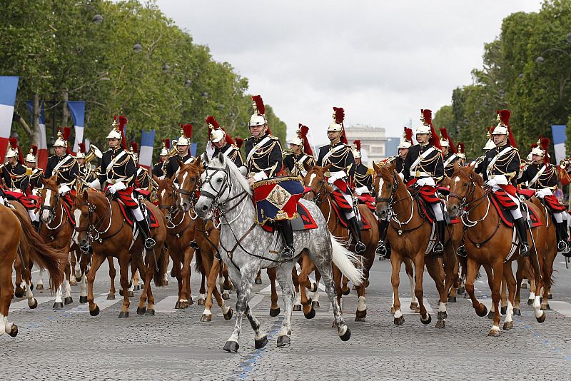 The French Republican Guard ride down the Champs Elysees during the traditional Bastille Day military parade in Paris