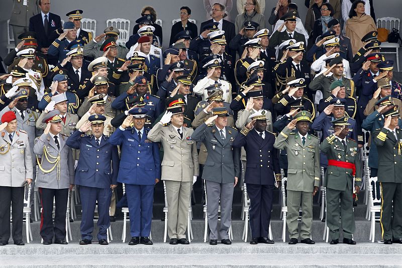 High ranking officers from various countries salute during the traditional Bastille Day military parade in Paris