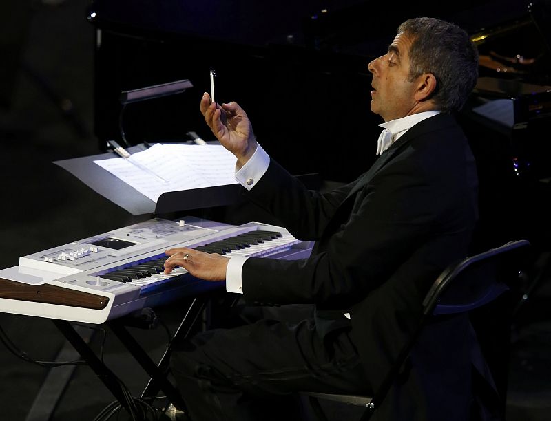 Actor Rowan Atkinson, known for his role as Mr Bean, performs during the opening ceremony of the London 2012 Olympic Games at the Olympic Stadium