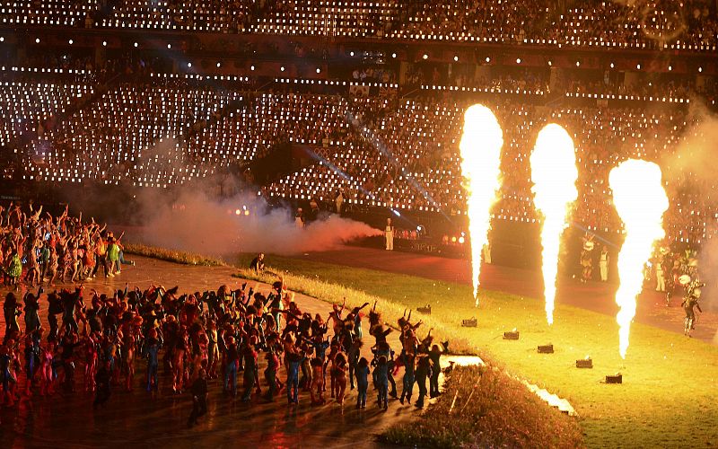 Performers take part in the opening ceremony of the London 2012 Olympic Games at the Olympic Stadium