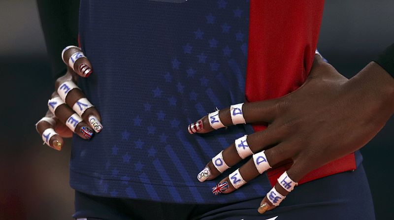 Olympic rings and the Union flag are seen painted on the fingernails of Destinee Hooker of the U.S. during their women's Group B volleyball match at the London 2012 Olympic Games at Earls Court in London