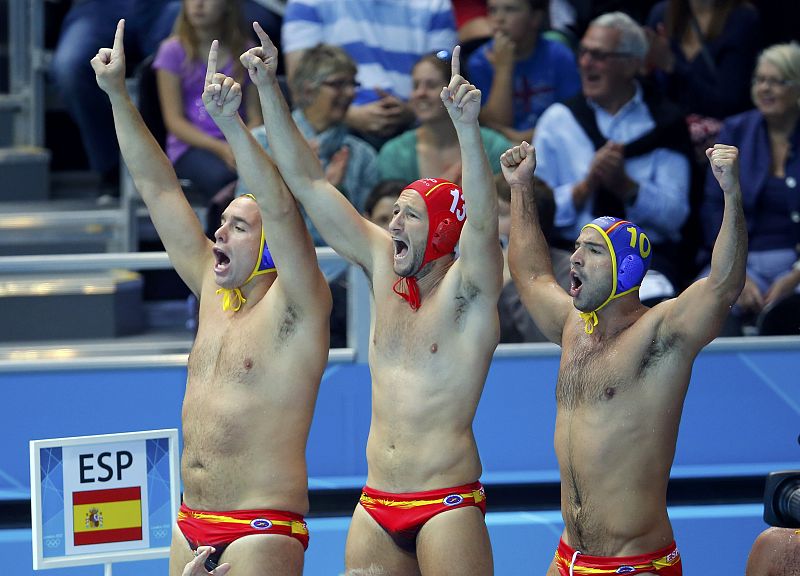 Spain's Daniel Lopez Pinedo and Felipe Perrone Rocha cheer for their team during their men's preliminary round Group A water polo match against Kazakhstan at the Water Polo Arena during the London 2012 Olympic Games