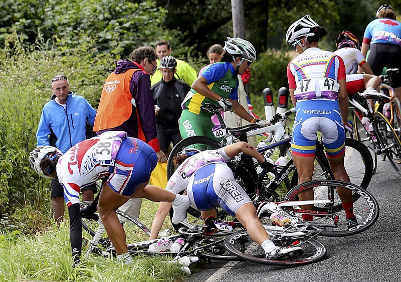 Cyclists try to recover from a crash during the women's cycling road race final at the London 2012 Olympic Games