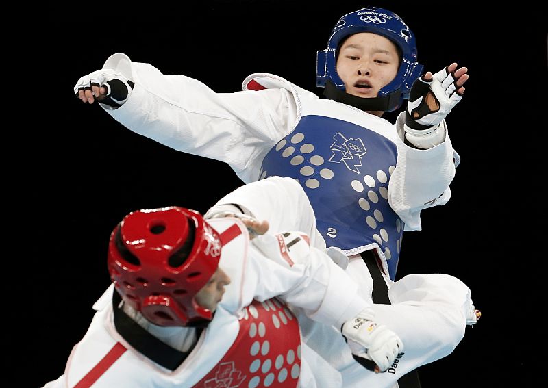 China's Wu Jingyu kicks Spain's Brigitte Yague Enrique during their women's -49kg gold medal taekwondo match during the London 2012 Olympic Games at the ExCeL arena