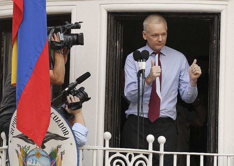 WikiLeaks founder Julian Assange gives the thumbs up sign after speaking to the media outside the Ecuador embassy in west London