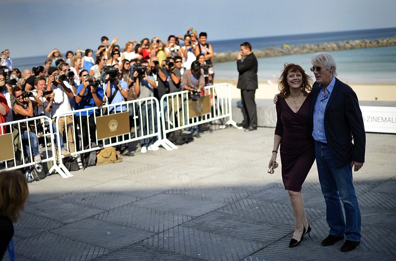 U.S. actors Gere and Sarandon embrace during the photocall for their movie "Arbitrage" during San Sebastian Film Festival