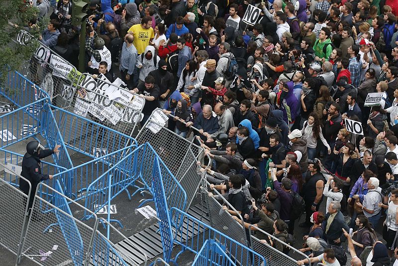 Protesters scuffle close to Spain's Parliament during a demostration in Madrid