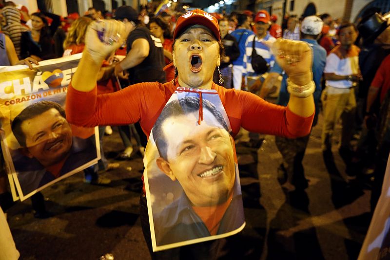 Supporters of Venezuelan president Hugo Chavez gather outside Miraflores Palace to wait for the results of Presidential elections in Caracas