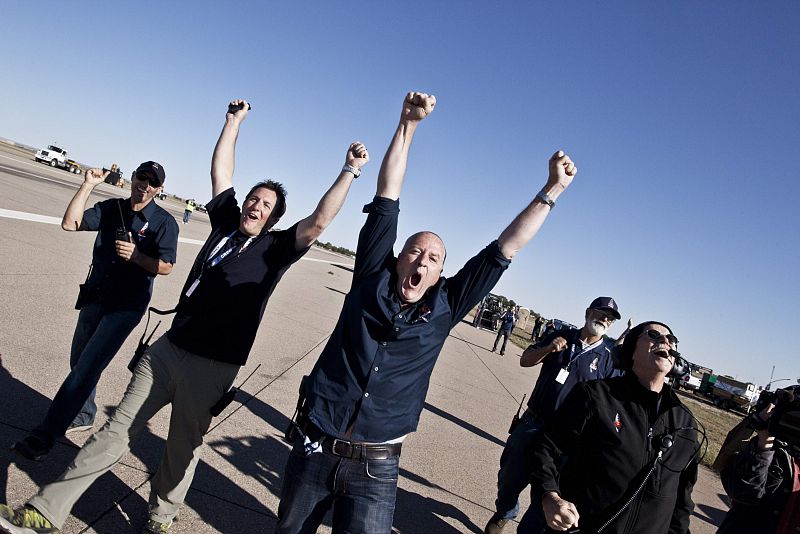 Handout photo of crew members celebrating the successful launch during the final manned flight for Red Bull Stratos in Roswell