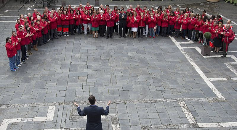 Spain's Crown Prince Felipe acknowledges the applause from the volunteers of the Red Cross Society, International Federation of Red Cross and Red Crescent Societies in Oviedo