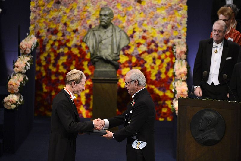 John B. Gurdon of Britain, joint winner of the 2012 Nobel Prize for Physiology or Medicine, smiles as he receives the prize from Sweden's King Carl XVI Gustaf during the Nobel Prize award ceremony at the Stockholm Concert Hall in Stockholm