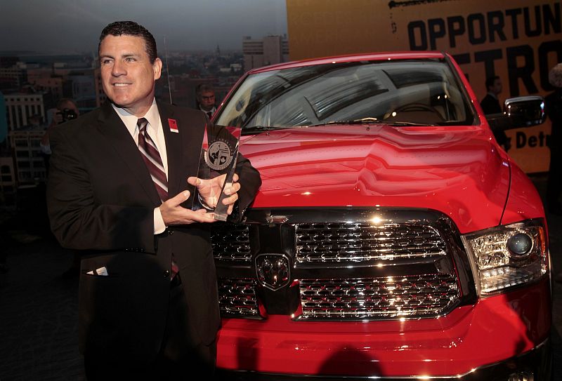 Fred Diaz, CEO of Chrysler's Ram Division, poses with a Ram pickup truck after it won the "Truck of the Year" award at the North American International Auto Show in Detroit