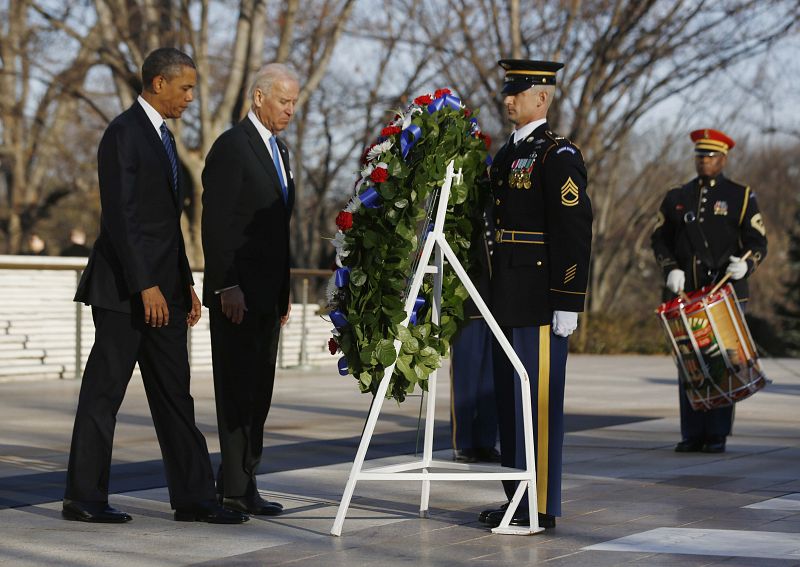 U.S. President Obama and Vice President Biden lay a wreath at the Tomb of the Unknown Soldier at Arlington National Cemetery near Washington