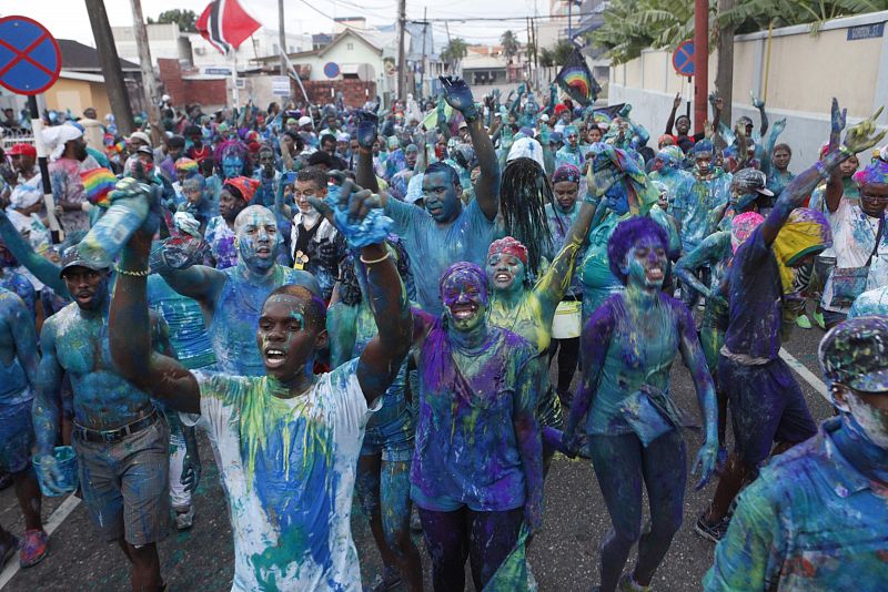 Revellers take to the streets during J'Ouvert celebrations, or "daybreak celebrations" in the capital city Port of Spain