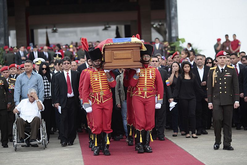 Handout photo of pallbearers carrying the coffin of Venezuela's late President Hugo Chavez to a hearse prior to a funeral parade in Caracas