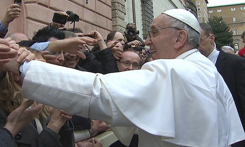 Newly elected Pope Francis greets crowds before his Angelus prayer in the Vatican