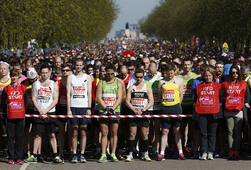 Runners observe a moment of silence before the start of the London Marathon in Greenwich
