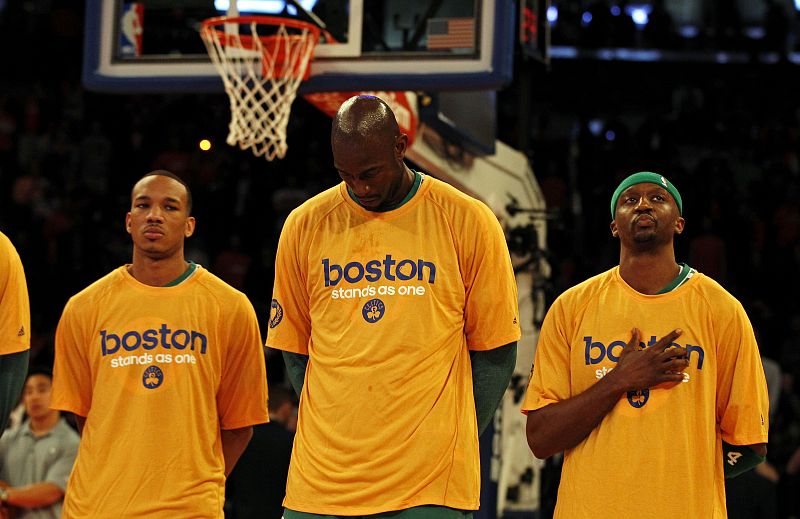 Boston Celtics center Kevin Garnett stands with his teammates during the national anthem before taking on the New York Knicks in Game 1 of their NBA Eastern Conference Quarterfinals basketball playoff series in New York