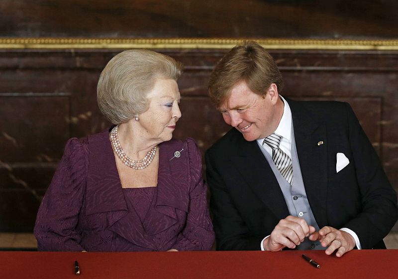 Crown Prince Willem-Alexander listens to Queen Beatrix of the Netherlands during the meeting at the Royal Palace in Amsterdam April 30, 2013, before Queen Beatrix's abdication ceremony