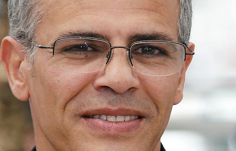 Director Abdellatif Kechiche poses during a photocall for the film "La Vie D'Adele" at the 66th Cannes Film Festival