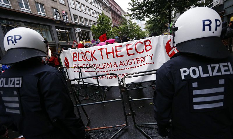 Police stand guard during a "Blockupy" demonstration near the ECB headquarters in Frankfurt