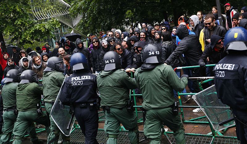 Police try to prevent protestors from breaking through barricades near the ECB headquarters during a "Blockupy" demonstration in Frankfurt