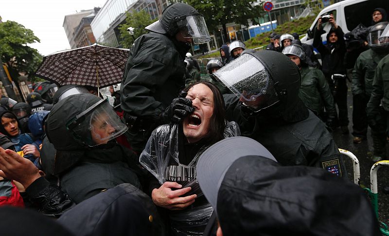 German riot police scuffle with protestors in front of the European Central Bank (ECB) head quarters during a anti-capitalism "Blockupy" demonstration in Frankfurt