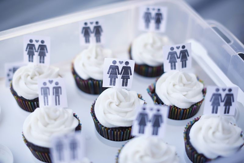 A box of cupcakes are seen topped with icons of same-sex couples at City Hall in San Francisco