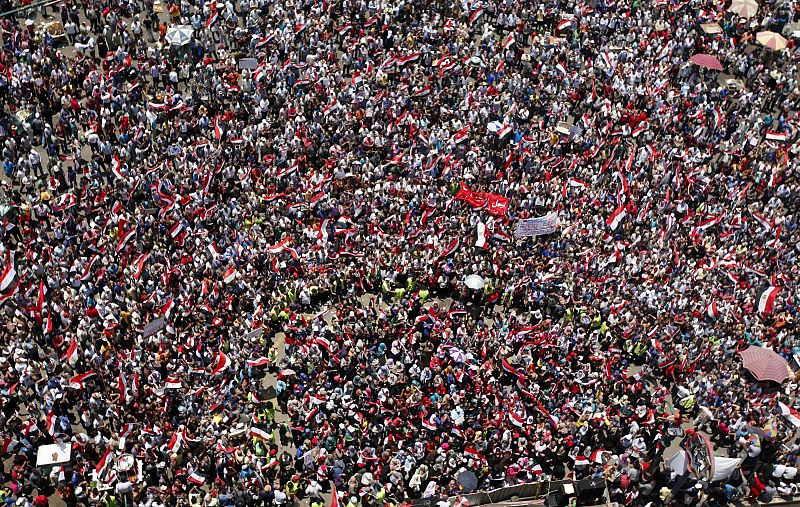 Protesters opposing Egyptian President Mursi shout slogans during a demonstration in Tahrir square in Cairo