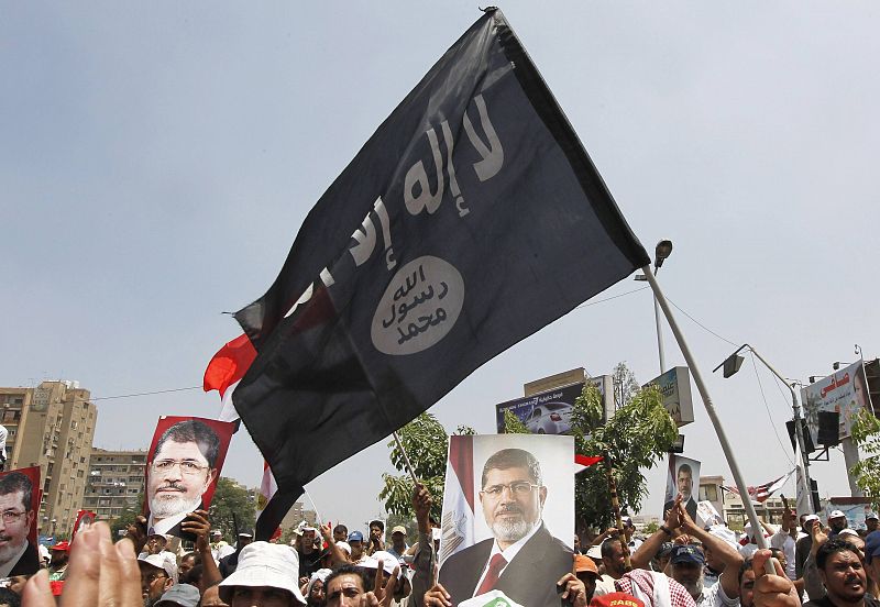 Members of the Muslim Brotherhood and supporters of ousted Egyptian President Mohamed Mursi shout slogans in Cairo