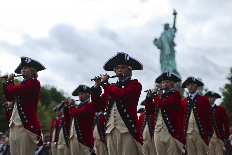 The 3d U.S. Infantry, traditionally known as 'The Old Guard', perform during a ceremony to reopen the Statue of Liberty and Liberty Island to the public in New York