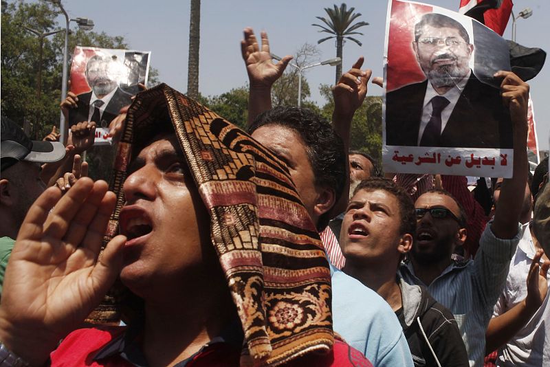 Protesters, who support former Egyptian President Mohamed Mursi, march near Cairo University in Cairo