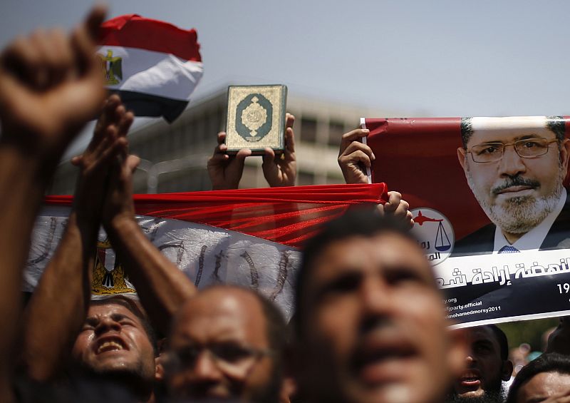 Protesters, who support former Egyptian President Mohamed Mursi, march near Cairo University in Cairo