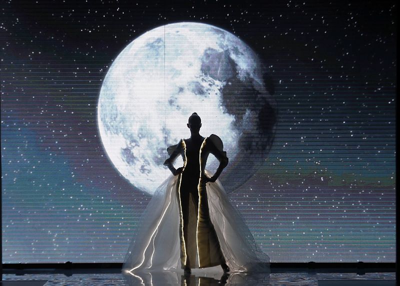 A model displays a wedding dress created by designer Sarda during the Mercedes-Benz Fashion Week in Madrid