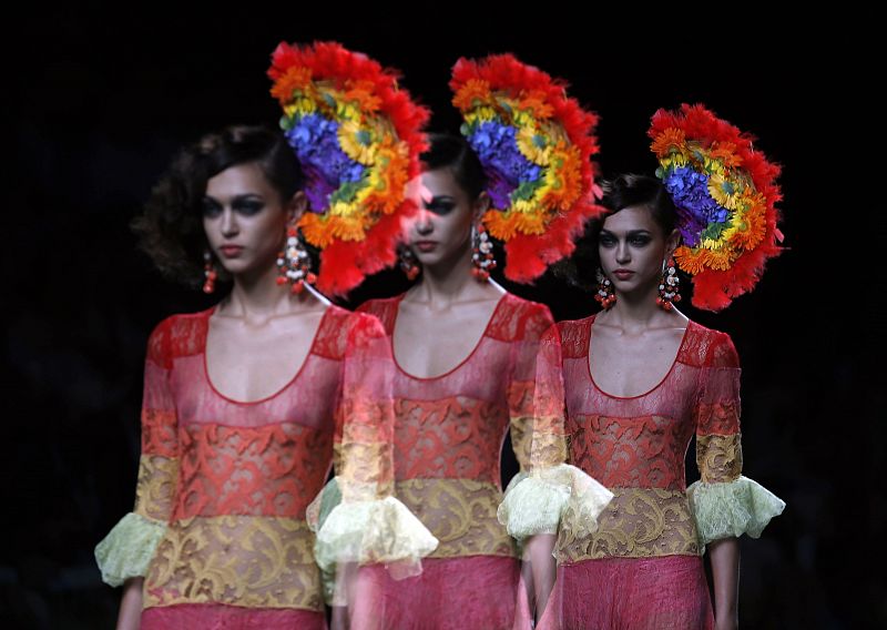 A model presents an outfit created by designer Francis Montesinos during the Mercedes-Benz Fashion Week in Madrid