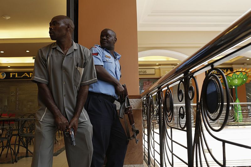 Police officers try to secure an area inside the Westgate Shopping Centre where gunmen went on a shooting spree, in Nairobi