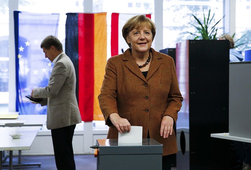 German Chancellor Merkel poses as she casts her ballot during the German general election (Bundestagswahl) at a polling station in Berlin