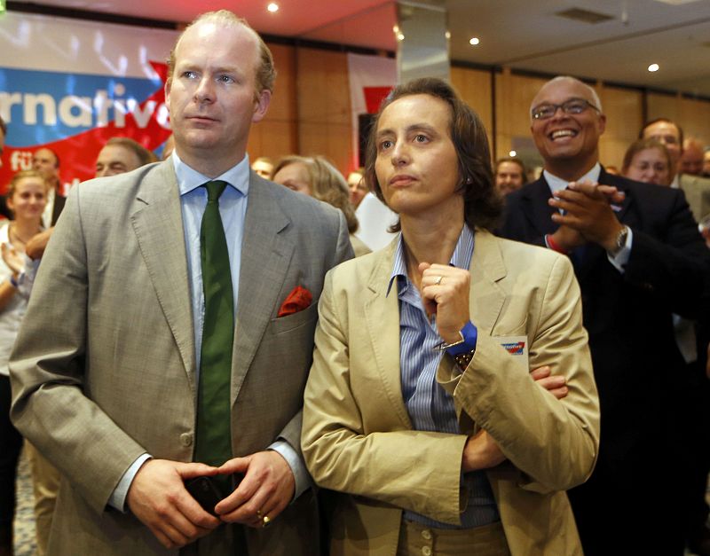 Parliament candidate Beartix Von Storch reacts next to an unidentified Alternative fuer Deutschland party (AfD) member after first exit polls in the German general election (Bundestagswahl) in Berlin