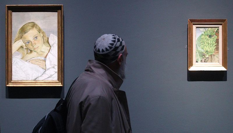 Visitor looks at paintings by British painter Freud during preview of exhibition at Kunsthistorisches Museum in Vienna