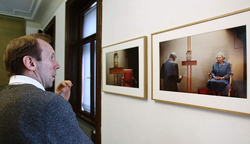 Dawson assistant to British painter Freud looks his photograph of Freud during an interview at Sigmund Freud museum in Vienna