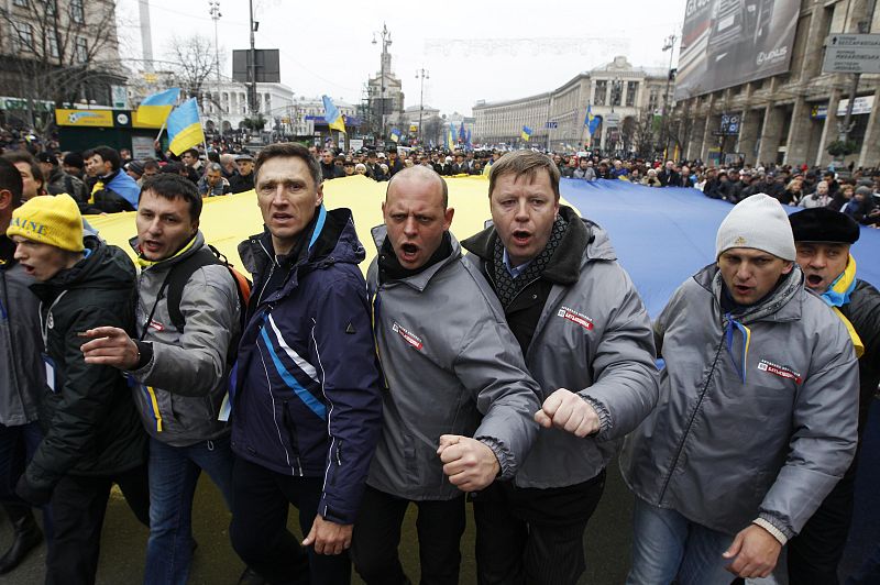 People attend a rally held by supporters of EU integration in Kiev