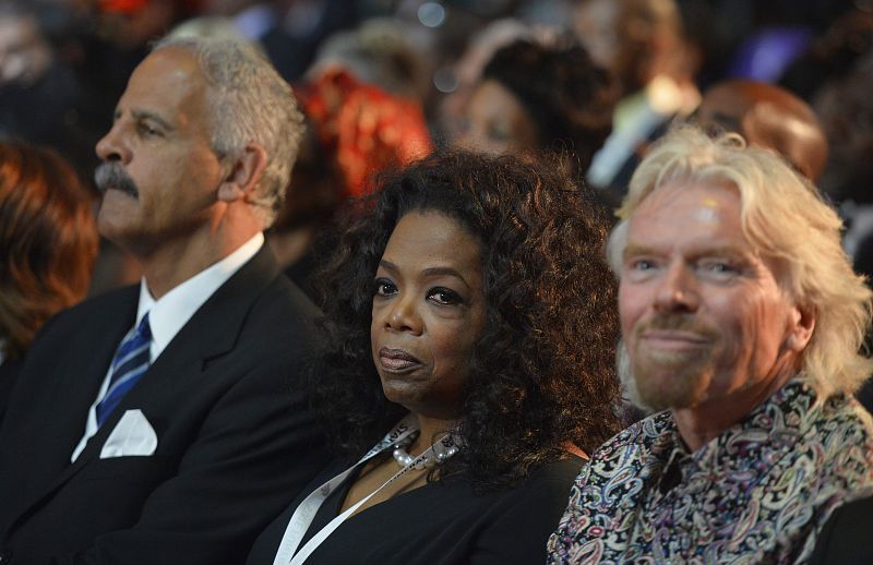 Celebridades en el funeral de Mandela: Stedman Graham (izd.); el empresario británico Richard Branson (dcha.) y la presentadora de TV Oprah Winfrey.