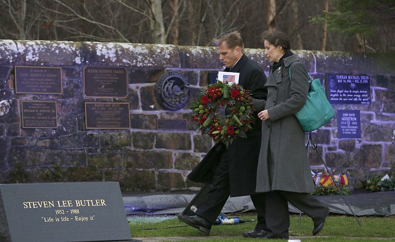 U.S. representatives Craig Lynes and Zoja Bazarnic prepare to lay a wreath at a memorial event on the 25th anniversary of the bombing of Pan Am flight 103, in Dryfesdale Cemetery, in Lockerbie, Scotland