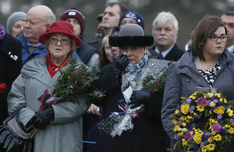 Jane Schultz, the mother of Lockerbie bombing victim Thomas, reacts during a memorial event on the 25th anniversary of the bombing of Pan Am flight 103, in Dryfesdale Cemetery, in Lockerbie, Scotland